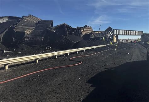 Colorado train derails, spilling mangled train cars and coal across a highway